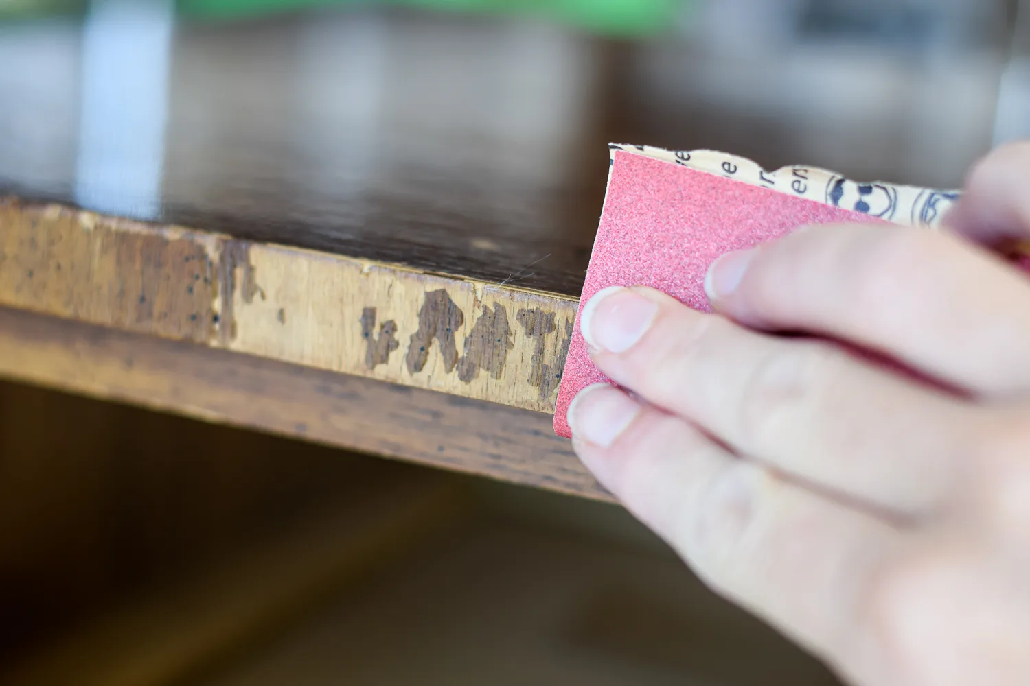 sanding a piece of furniture smooth